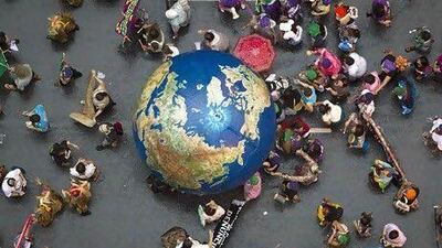 Activists participate in a global march alongside the UN Conference on Sustainable Development in Rio de Janeiro, Brazil. Felipe Dana / AP Photo