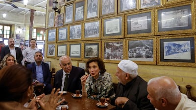 Unesco chief with Iraqi officials at the Shabandar Cafe in Baghdad. Reuters