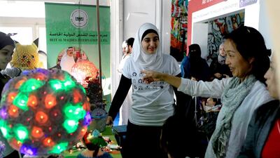 Students from Beit al Mardes International School show off their waste paper project. Ravindranath K / The National
