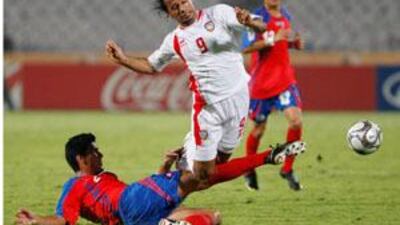 Costa Rica's Jose Mena, left, tackles the UAE's Ahmed Ali in their Under 20 World Cup quarter-final match in Cairo.
