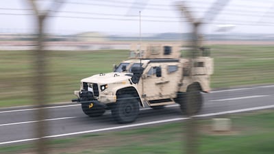An armoured vehicle inside the perimeter of RAF Fairford. Police are investigating at least five strands after arresting five men near the airbase. Reuters