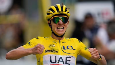 Stage winner Tadej Pogacar crosses the finish line. AP