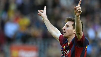 Barcelona's Argentinian forward Lionel Messi scored three times in Barcelona's 7-0 rout of Osasuna at the Camp Nou on March 16, 2014, to pass Paulino Alcantara's 369 and become Barcelona's all-time leading scorer. LLUIS GENE / AFP