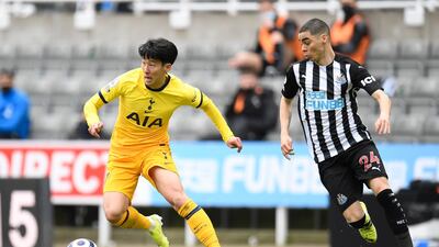 Tottenham's Son Heung-Min runs with the ball away from Newcastle's Miguel Almiron. EPA