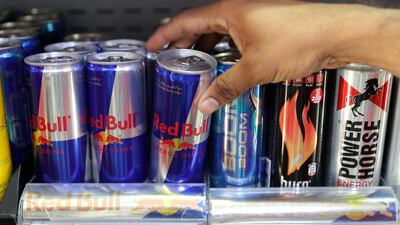 ABU DHABI , UNITED ARAB EMIRATES , OCT 25 – 2017 :- One of the customer picking up the energy drink from the grocery store in Abu Dhabi. (Pawan Singh / The National)