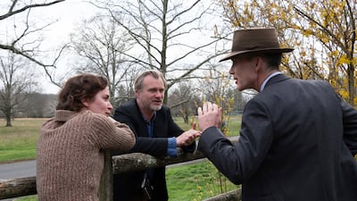 Director Christopher Nolan with actors Emily Blunt and Cillian Murphy on the set of Oppenheimer. AP
