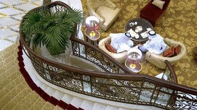 Emirati men drink tea in the lobby of the newly opened St Regis Hotel Nations Tower in Abu Dhabi. Christopher Pike / The National