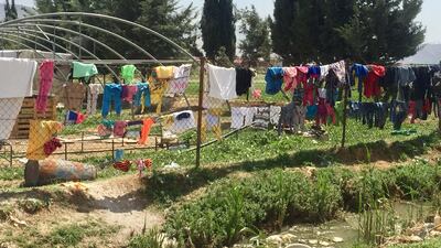 Refugees' laundry strung over a fence in the documentary 'Men on Hold'. Courtesy Forward Film Productions / Muna Khalidi