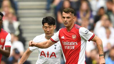 Granit Xhaka of Arsenal breaks past Son Heung-Min of Tottenham during the pre-season friendly on Sunday.