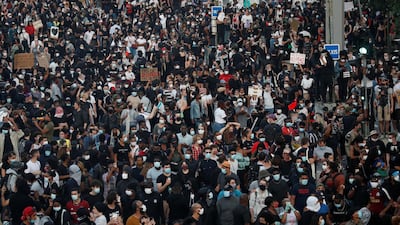 People attend a banned demonstration planned in memory of Adama Traore, a 24-year old black Frenchman who died in a 2016 police operation. Reuters