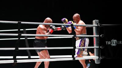 Mike Tyson coners Roy Jones, Jr. during their heavyweight exhibition boxing bout. Reuters