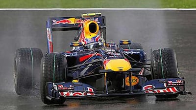 Red Bull's Mark Webber takes a curve on the rain-soaked track during practice at Spa yesterday for the Belgian Grand Prix.