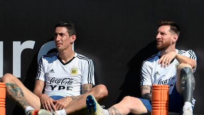 Argentina players Angel Di Maria, left, and Lionel Messi take a break during a training session in Rio de Janeiro. AFP