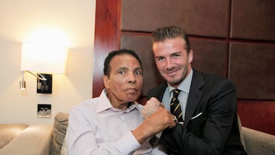 Football player David Beckham and boxing legend Muhammad Ali, left, pose for a photograph during the Beyond Sport Summit in London in this July 24, 2012 file photo. Action Images for Beyond Sport / John Marsh / Pool / Reuters