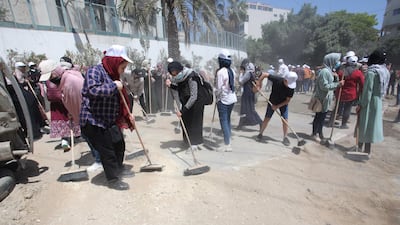 Volunteers clean Gaza's streets as part of the Han'amerha (we will rebuild it) campaign. All photos by WAFA