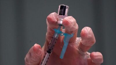 Pharmacist prepares a Pfizer Covid-19 vaccine at The New Jewish Home long-term care facility in New York City, December 21, 2020. AFP