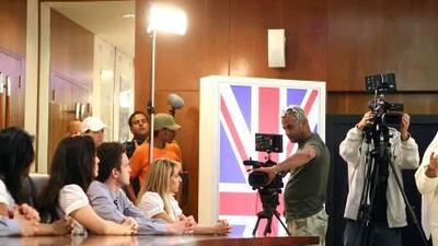 Dr. Sulaiman Al Fahim, the CEO of Hydra Properties, right, addresses the contestants of the reality show Hydra Executives filmed in Abu Dhabi.