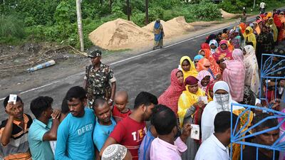 A paramilitary soldier stands on guard in Kolkata after reports that violence between rival party workers had led to fatalities on Saturday
