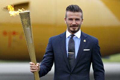 David Beckham was one of the first major footballers to become as known for his style on and off the pitch. AP