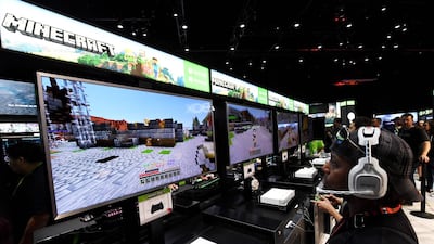 Gamers in the Microsoft Xbox exhibit play the "Minecraft" game on day one of E3 2017, the three day Electronic Entertainment Expo, one of the biggest events in the gaming industry calendar. AFP