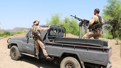 Members of the Yemeni government forces ride on a military pick-up vehicle as they patrol a road leading to a frontline of clashes with Iran-aligned Houthi fighters, in Taiz. Reuters