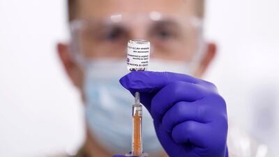 A military medic prepares the Oxford-AstraZeneca coronavirus vaccine before administering it to patients at the Elland Road mass vaccination centre in Leeds, England. AP