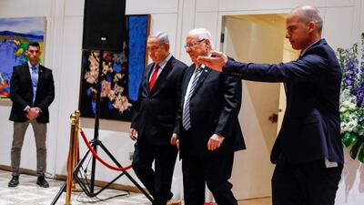 Israeli President Reuven Rivlin (C-R) and Prime Minister Benjamin Netanyahu (C-L) walk together at the former's residence in Jerusalem on April 17, 2019. AFP
