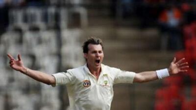 Australian cricketer Brett Lee celebrates after taking the wicket of Indian batsman Gautam Gambhir.