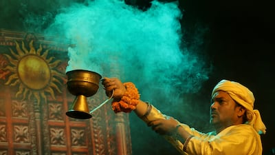Hindu priests in Kolkata, India, perform the Ganga Aarti ritual during the annual Gangasagar Fair, which draws millions of pilgrims. EPA