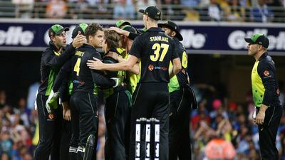 Australia celebrate the wicket of Lokesh Rahul in the first Twenty20 international in Brisbane on Wednesday. AP Photo