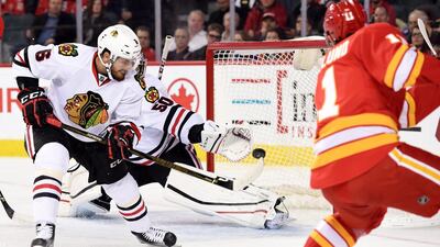 Chicago Blackhawks defenceman Michal Kempny, No 6, and goalie Corey Crawford, No 50, stop a shot from Calgary Flames centre Mikael Backlund, No 11, during the first period at Scotiabank Saddledome. Candice Ward