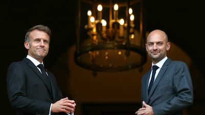 French caretaker minister of foreign affairs Jean-Noel Barrot, right, welcomes President Emmanuel Macron for talks with European and Arab leaders in Paris. AP