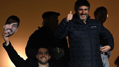 Nacional fans with Luis Suarez posters and masks. AFP