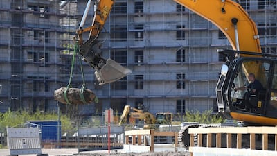 An unexploded bomb from the Second World War is removed in Berlin on April 20, 2018 after police evacuated thousands of people from a central area of the German capital and shut down the main train station. Britta Pedersen / dpa via AP