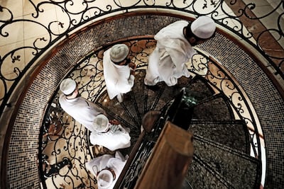 A group of men walk up the staircase prior to eating lunch at the Al Ibrahimi restaurant. Christopher Pike / The National Reporter