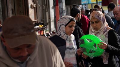 Shoppers buy decorations to celebrate Ramadan which begins with the new moon next week. AP Photo