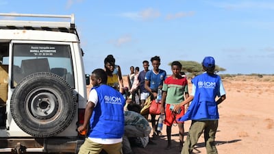 Members of the International Organisation for Migration assist survivors after a migrant boat capsized off the coast of Djibouti, killing at least 109 people. AFP