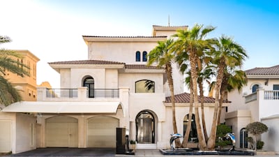 The front of the property with ornamental dolphins.