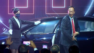 Foxconn founder Terry Gou, right. The Taiwanese company that manufactures smartphones for Apple and other global brands has big plans to produce electric cars under a similar contract model. AP