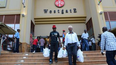 Customers leave the Westgate shopping mall after it reopened on July 18, 2015 in Nairobi, Kenya. Simon Maina / AFP