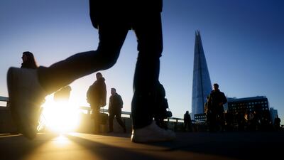 Commuters on London Bridge made their way into their offices during the morning rush hour on Thursday. Advice to work from home was dropped on Wednesday by Prime Minister Boris Johnson. PA