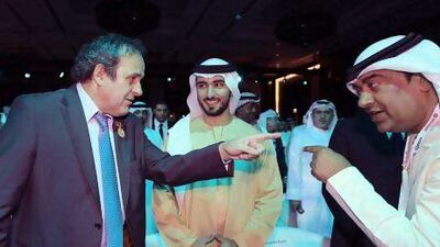 French Michel Platini, left, President of the Union of European Football Associations, gestures with secretary-general of the UAE National Olympic Committee, Mohammad Al Kamali, right, next to H.H.Sheikh Majid bin Mohammed bin Rashid Al Maktoum, centre, Chairman of Dubai Culture and Arts Authority during a session at the 7th edition of the Dubai International Sports Conference in the Gulf Emirate of Dubai. Ali Haider / EPA