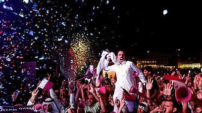 Qataris celebrate in Doha after the Gulf state was chosen to become the first Arab state to host the World Cup.