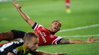 Theo Walcott has asked his Arsenal teammates to avoid getting ahead of themselves after 3-0 win over Fenerbahce.