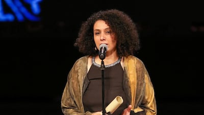 Director Nada Riyadh receives an award during the closing ceremony of the 41st Cairo International Film Festival. Reuters