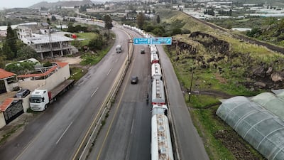 Iraqi oil trucks lined up along the highway between Tartus and Latakia in Syria. EPA