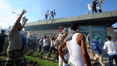 Tunisian protesters break into the US Embassy in Tunis during a protest against a film that mocked Islam. Fethi Belaid / AFP