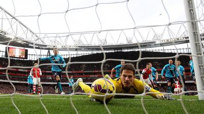 Asmir Begovic of Stoke City fails to stop the ball crossing the line as Alexis Sanchez (not pictured) of Arsenal scores his team’s third goal from a free-kick. Clive Rose / Getty Images