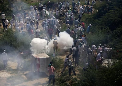 Indian police use tear gas to disperse farmers at New Delhi's border with neighbouring Uttar Pradesh. AP