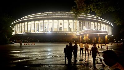 India's parliament building is illuminated for a midnight session to launch the Goods and Services Tax (GST) in New Delhi, India on Friday, June 30, 2017. Manish Swarup / AP Photo